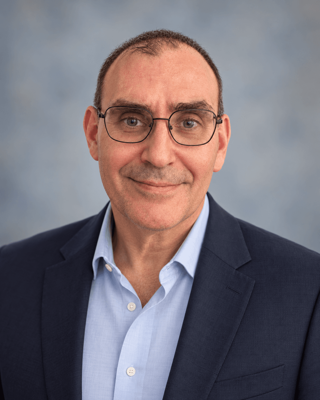 Bernie Grohsman in a navy blazer and light blue shirt